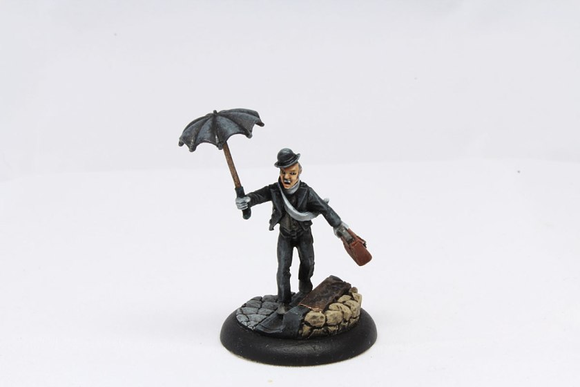 Butler with umbrella and suitcase.